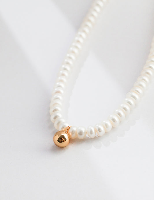 Pure Serenity: Tiny Gold Ball Pearl Necklace